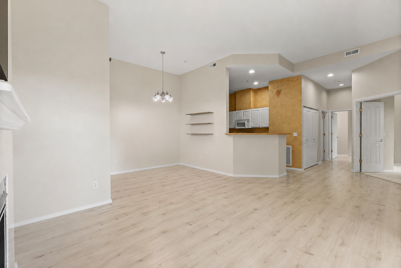 Furniture removal before and after in an open living and dining room after